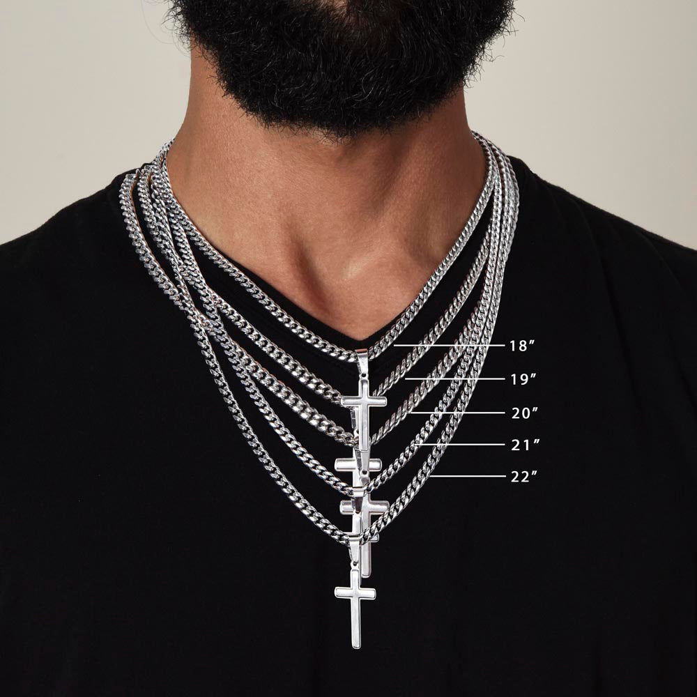 Man wearing multiple silver necklaces with a cross pendant, showing length measurements.