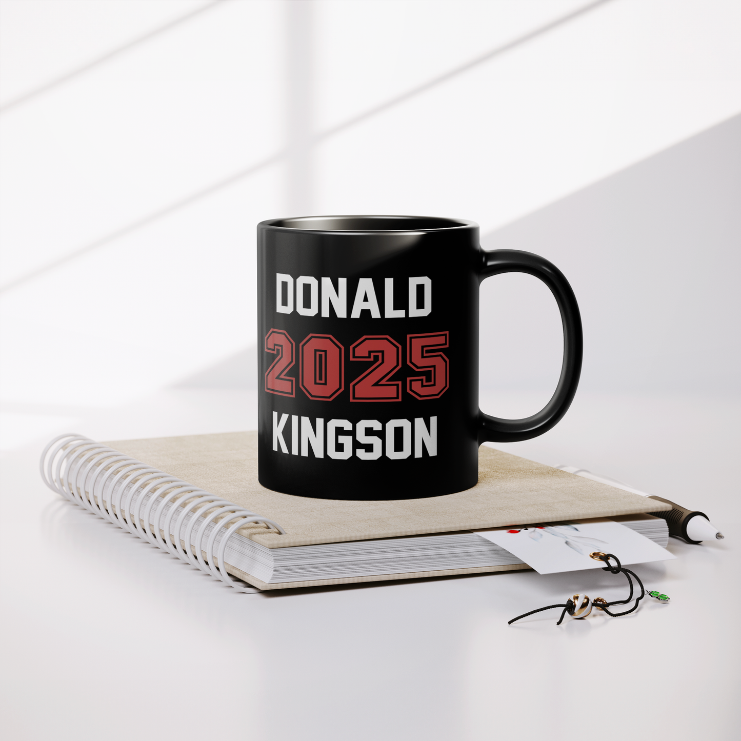11_oz_Black_Ceramic_Mug_with_different_d_Lifestyle_Notebook_Mockup.png